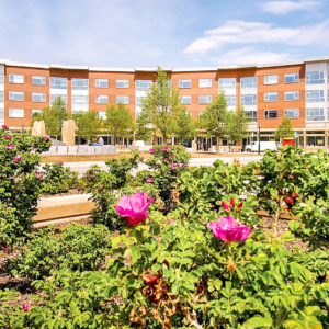 building exterior and flower landscaping | Crescent Flats Apartments